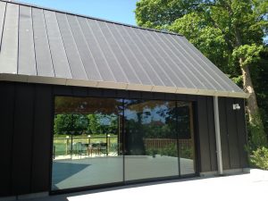 view of a museum building clad and roofed in standing seam zinc, completed by Kingsley Roofing