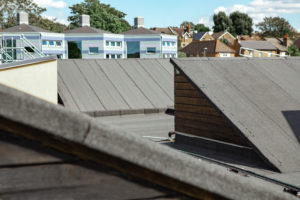 Felt roof with rooflight and cable runners and cladding